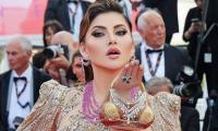 Urvashi Flaunts Bikini Shaped Clutch