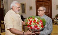 First anniversary: PM Modi meets President Mukherjee, VP Ansari