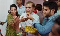 Laddoos on us! Mahagathbandhan rejoices