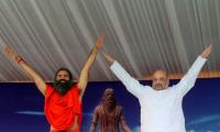 PIX: Amit Shah, Smriti, Rajnath roll out yoga mats