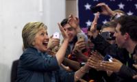 On the eve of elections, polls give lead to Clinton