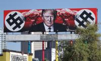 Now, a US billboard shows Trump with swastika-like symbols