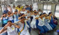 PHOTOS: World stretches and twists for Yoga day