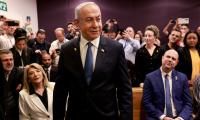 Defiant Netanyahu takes stand in landmark graft trial