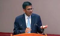 Former CJI Chandrachud denies reports of...