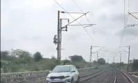 Woman drives car on railway track near Hyderabad