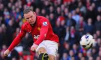 Wenger admits interest in signing Rooney, Fabregas