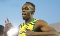 CWG PHOTOS: Bolt hits the track; delights crowd