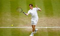 Wimbledon PHOTOS: Murray sets up semi-final showdown with Federer