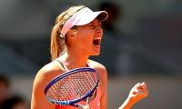 Madrid Open: Sharapova battles past Wozniacki into semis