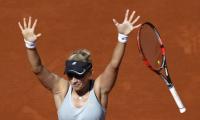 PHOTOS: Third seed Halep knocked out of French Open