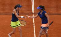 Sania-Martina pair storms into quarters; Paes, Bopanna ousted