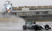 US Grand Prix: Hamilton fastest as fans shut out by rain
