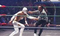 What fun! F1 champion Hamilton wrestles with Mexican culture
