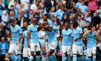 Man City flex muscles as English clubs break spending record