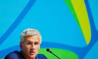 US swimmer Lochte says gun held to forehead in taxi hold-up