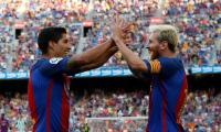 Suarez treble and Messi double lift six-goal Barca