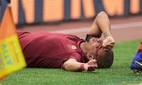 Euro football: Roma win bloody derby; Hamburg record 1st win