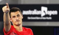 Angry Tomic gives Federer bitter retort 