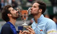 Lopez and Lopez break Grand Slam duck in Paris