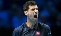 PHOTOS: Djokovic digs deep to repel Raonic onslaught