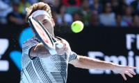 Federer wary of Berdych test after fending off Rubin challenge