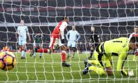 EPL PHOTOS: Ten-man Arsenal win thriller; Chelsea stretch lead