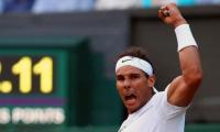 Red-hot Nadal rolls over American Young