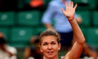 PHOTOS: Halep downs Pliskova to set up Ostapenko final