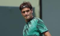 Federer cruises past defending champ Mayer into Halle semis