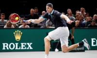 Isner keeps Tour finals hopes alive as Nadal withdraws in Paris