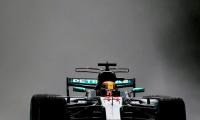 Hamilton beats rain to break Schumacher's pole record