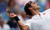 Federer wears down Wawrinka to maintain mastery over compatriot