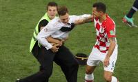 PHOTOS: Anti-Kremlin protesters invade pitch during World Cup final