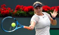 American teen Anisimova stuns Wang, Tomic crashes out