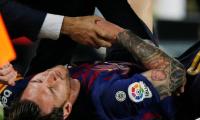 PHOTOS: Messi injury blow as Barca go top with win over Sevilla