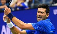 US Open PICS: Djokovic, Federer through; Venus exits