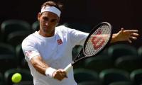 Federer opposes on-court coaching