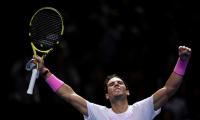 Nadal battles from brink to beat Medvedev