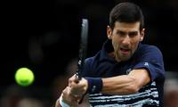 Djokovic sees off Edmund; Barty in WTA Finals semis