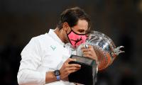 Nadal continues Paris reign with record-equalling Slam