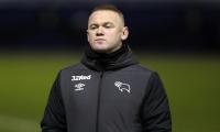 Rooney ends playing career to become Derby manager