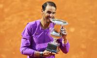 Nadal overcomes blip to down Djokovic in final