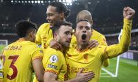 Liverpool beat Arsenal to cut City's lead; Spurs win