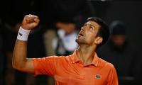 Djokovic keeps top spot after beating Auger-Aliassime