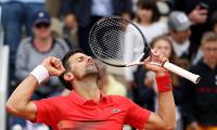 Djokovic keeps title defence on track, Zverev survives