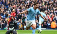 EPL PIX: Arsenal send title warning; City crush Reds