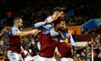 EPL PIX: Villa up to second; United lose