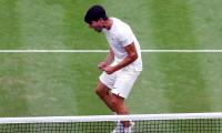 Wimbledon PIX: Alcaraz, Sinner ease into quarters