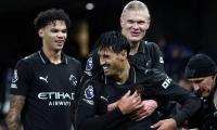 Manchester City survive scare; Spurs hold Newcastle